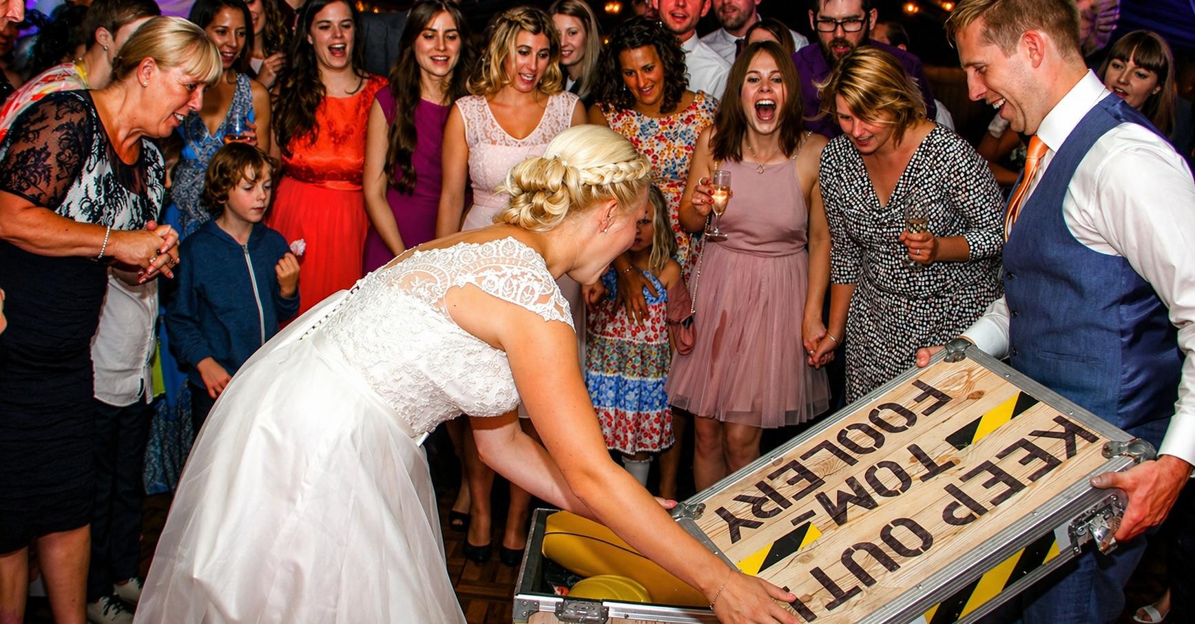 Bride and groom enjoying Tomfoolery entertainment supplied by DJ Mike Hackett