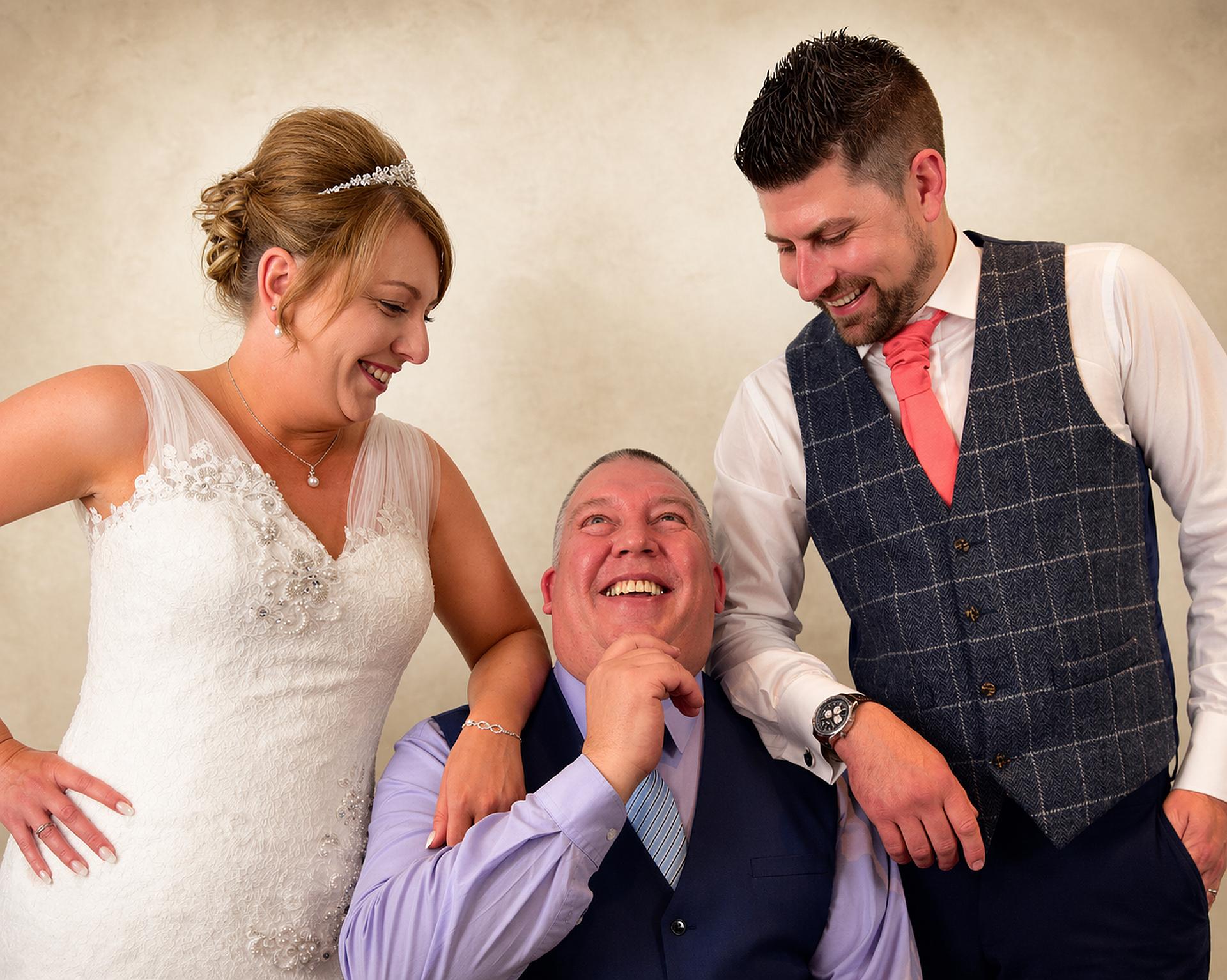 Wedding couple with DJ Mike Hackett after a successful celebration