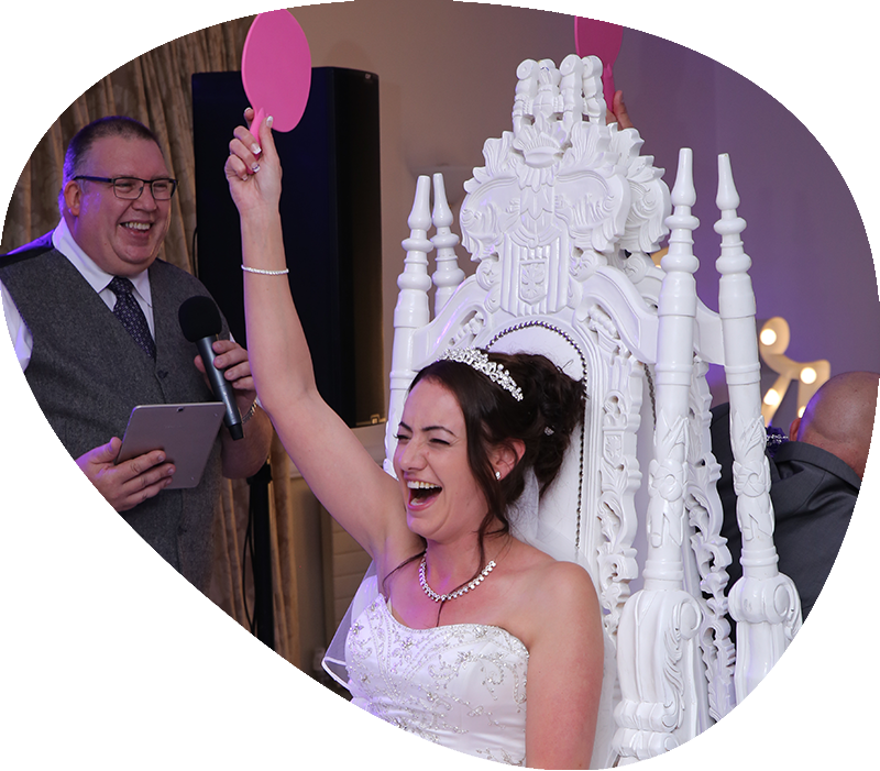 DJ Mike hosting the Mr & Mrs game with guests enjoying the moment