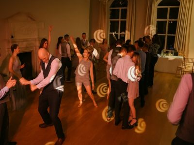 Guests dancing enthusiastically during the evening party